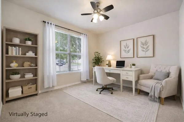 a work room with furniture and a window