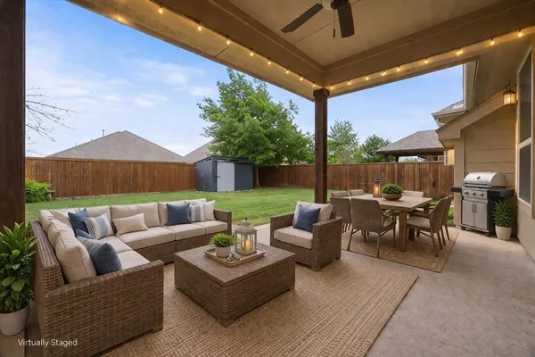 a patio with patio a couch and chairs