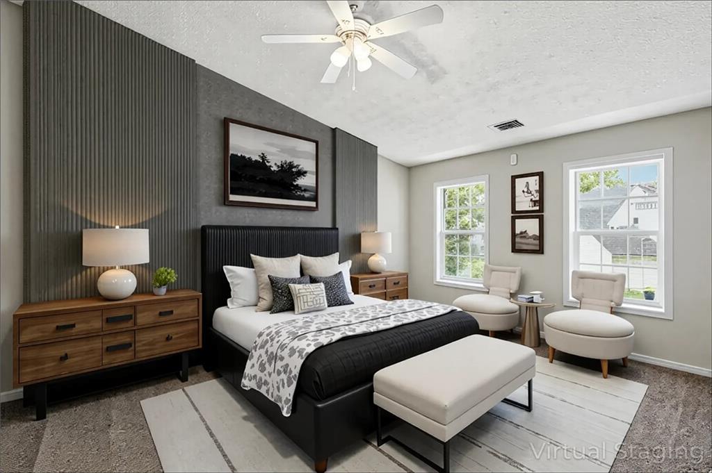 5487 Walnut Lane Lithonia, GA 30038 - Photo 19 of 43 a spacious bedroom with a bed a lamp and a chandelier
