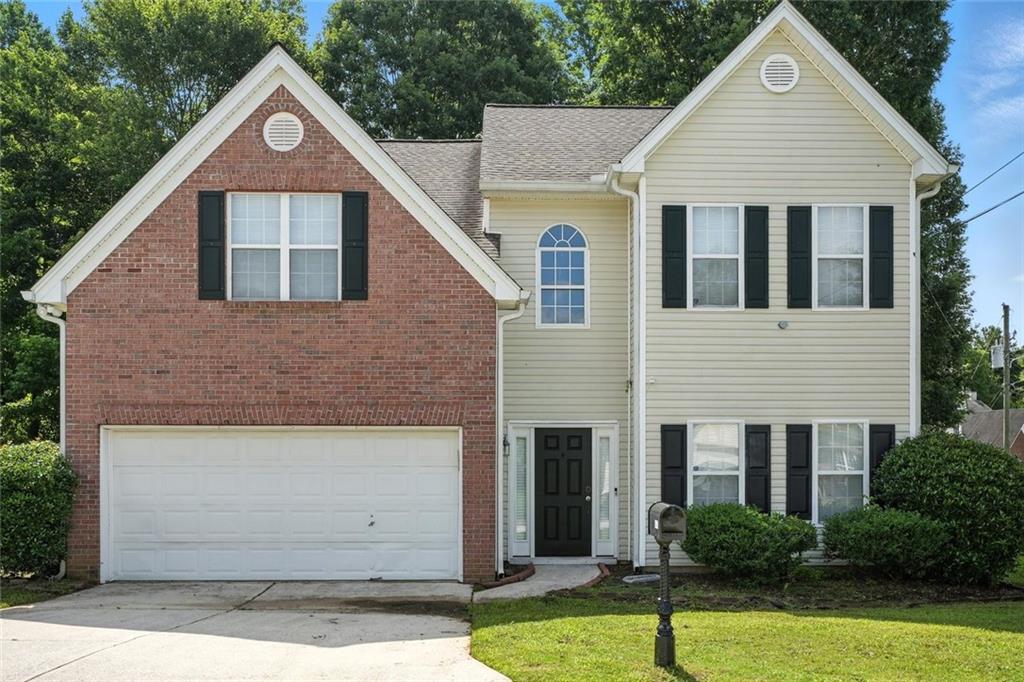 5487 Walnut Lane Lithonia, GA 30038 - Photo 2 of 43 a view of front of house with a yard