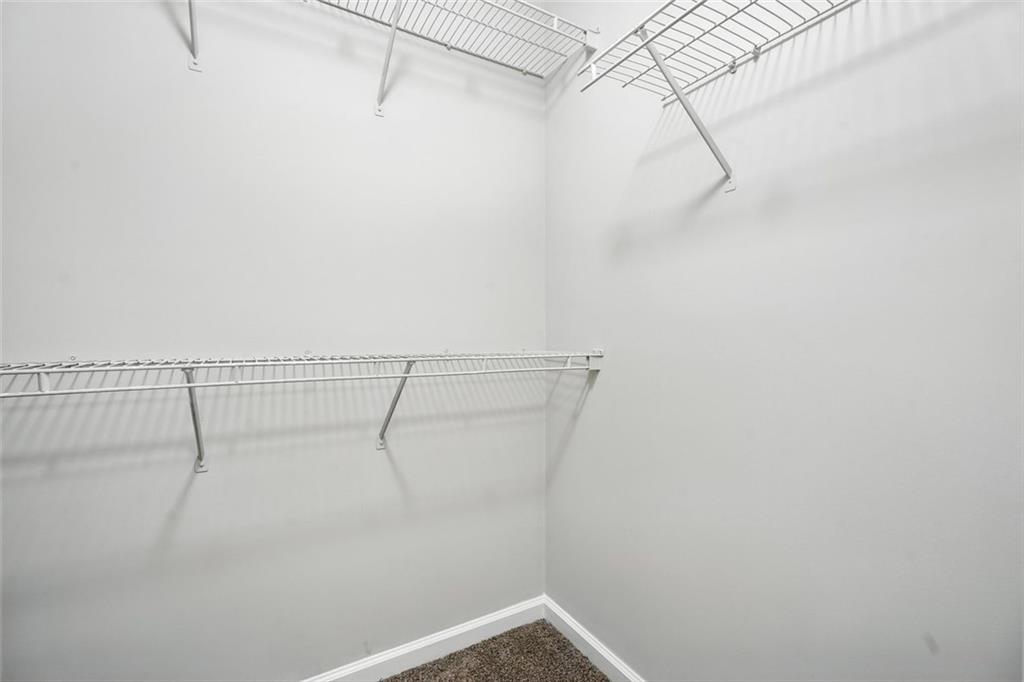 5487 Walnut Lane Lithonia, GA 30038 - Photo 24 of 43 a view of a room with racks on the wall