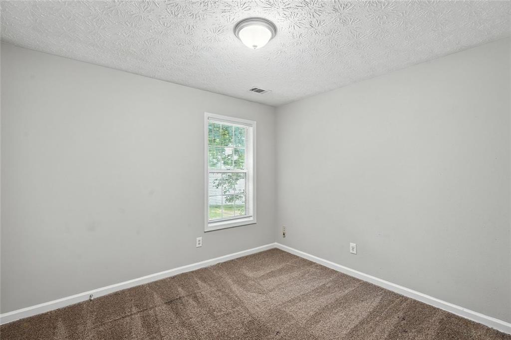5487 Walnut Lane Lithonia, GA 30038 - Photo 27 of 43 an empty room with a window