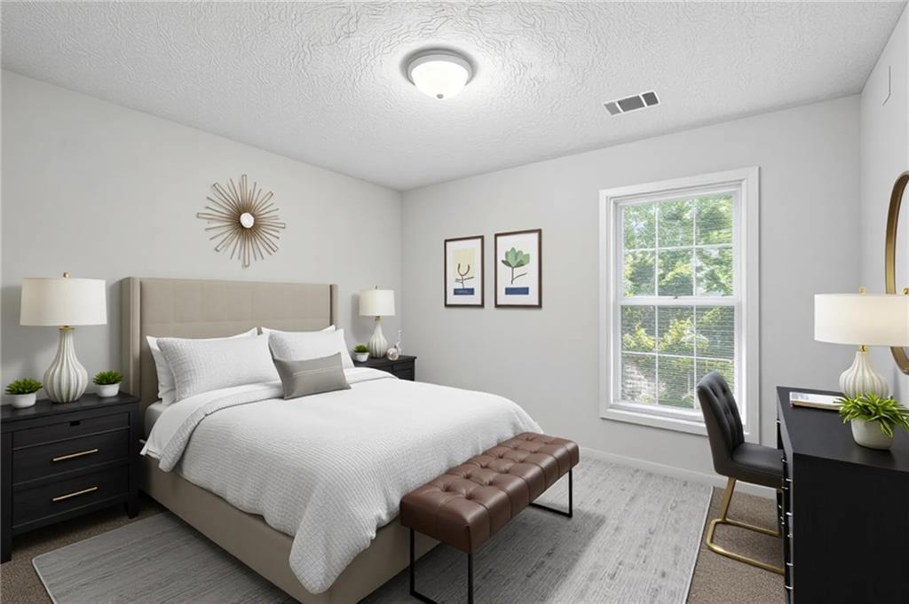 5487 Walnut Lane Lithonia, GA 30038 - Photo 29 of 43 a bedroom with a bed and wooden floor