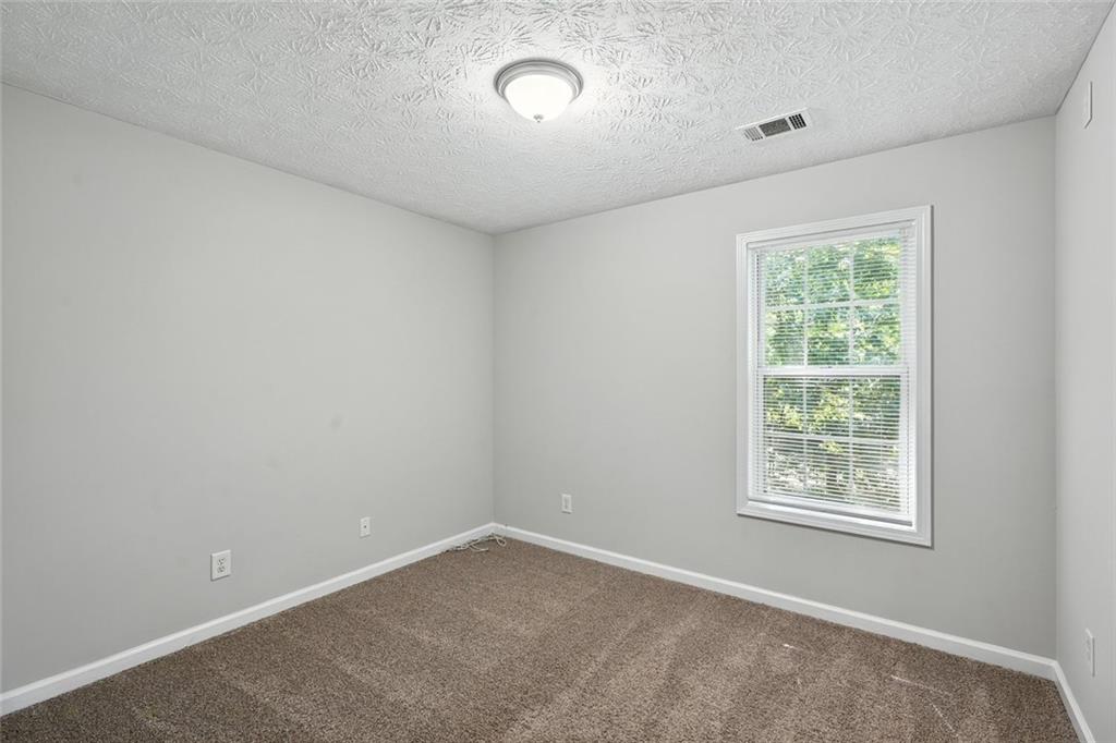 5487 Walnut Lane Lithonia, GA 30038 - Photo 30 of 43 an empty room with a window
