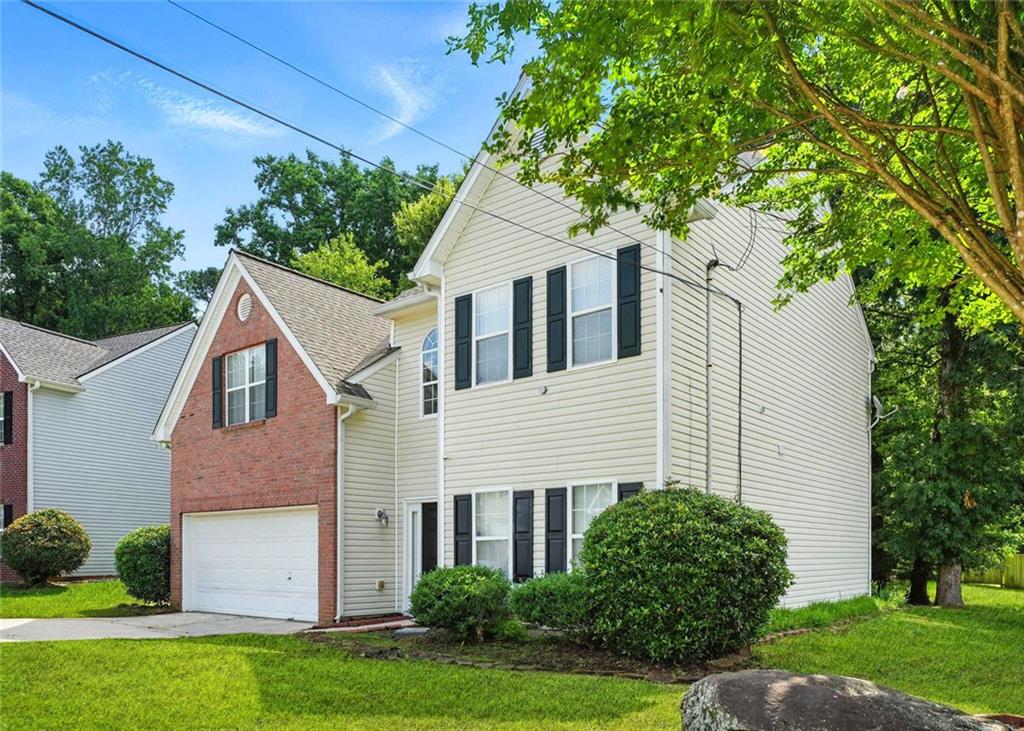 5487 Walnut Lane Lithonia, GA 30038 - Photo 3 of 43 a house that has a tree in front of the house
