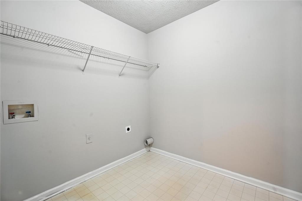 5487 Walnut Lane Lithonia, GA 30038 - Photo 32 of 43 a view of a room with racks on the wall