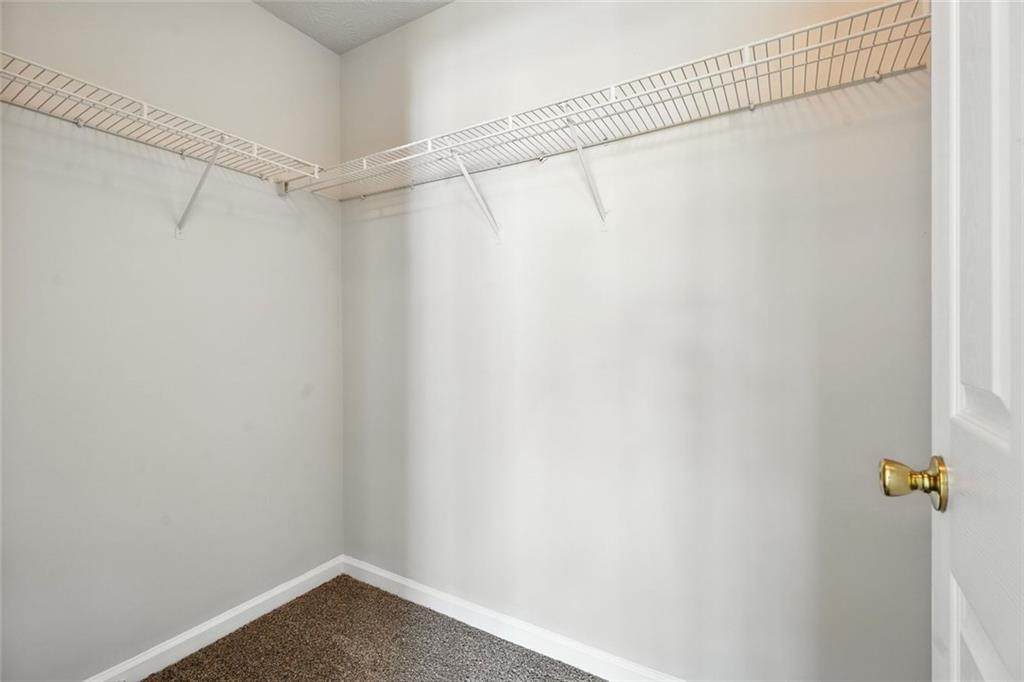 5487 Walnut Lane Lithonia, GA 30038 - Photo 38 of 43 a view of a room with racks on the wall