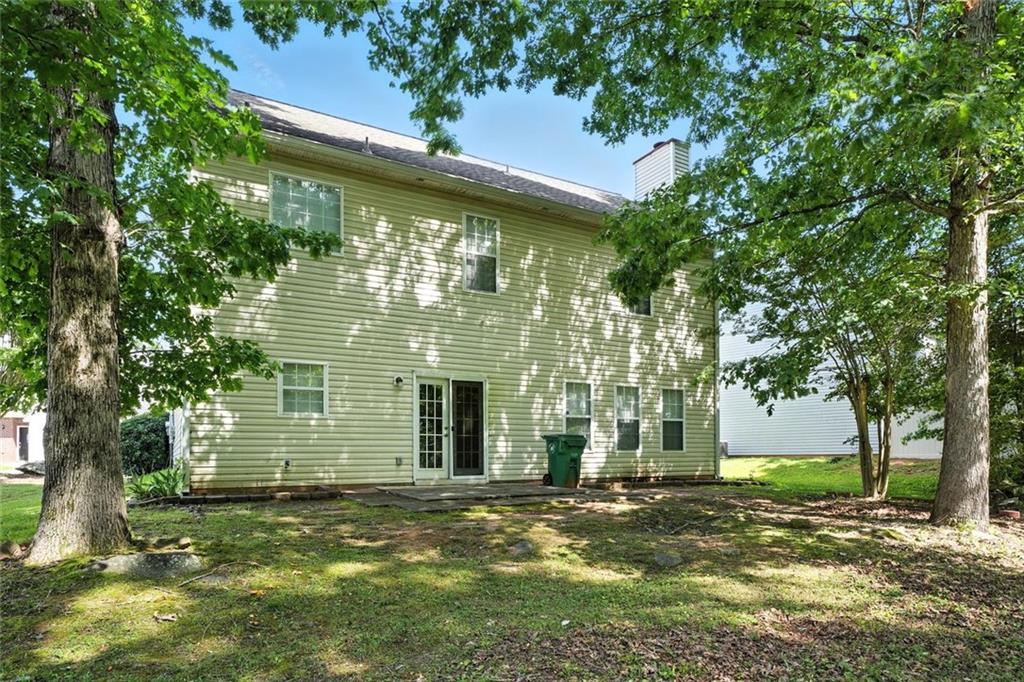 5487 Walnut Lane Lithonia, GA 30038 - Photo 41 of 43 a front view of a house with a garden