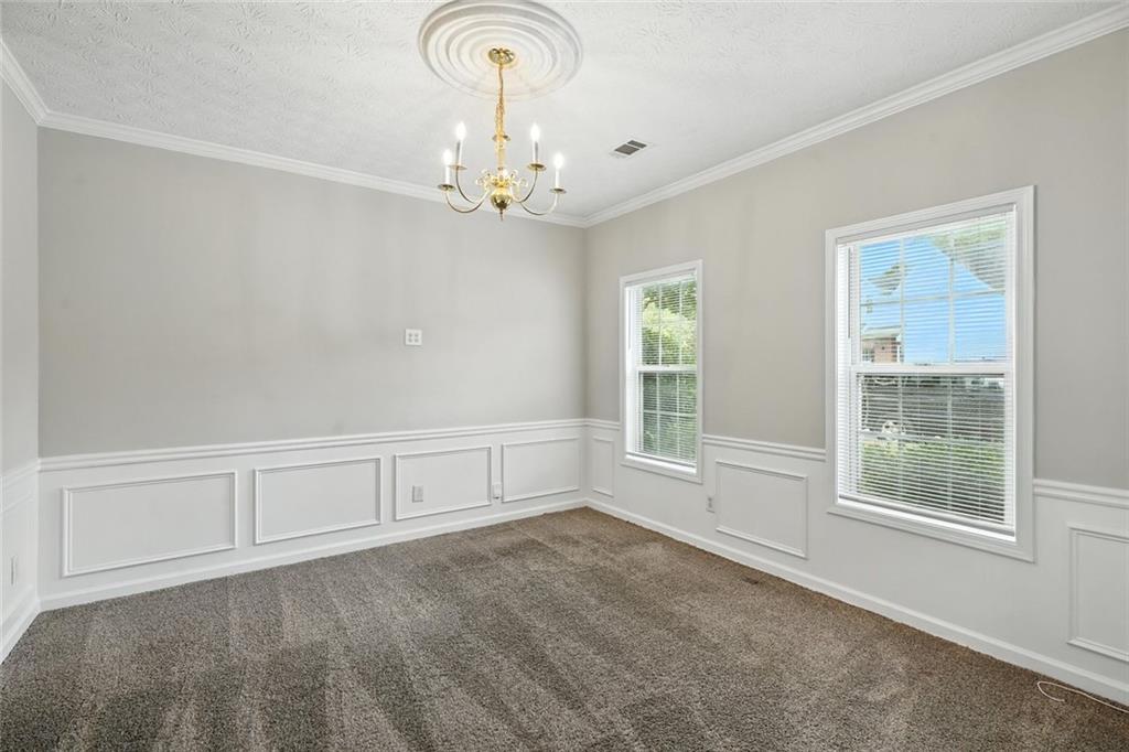 5487 Walnut Lane Lithonia, GA 30038 - Photo 6 of 43 a view of an empty room with a window