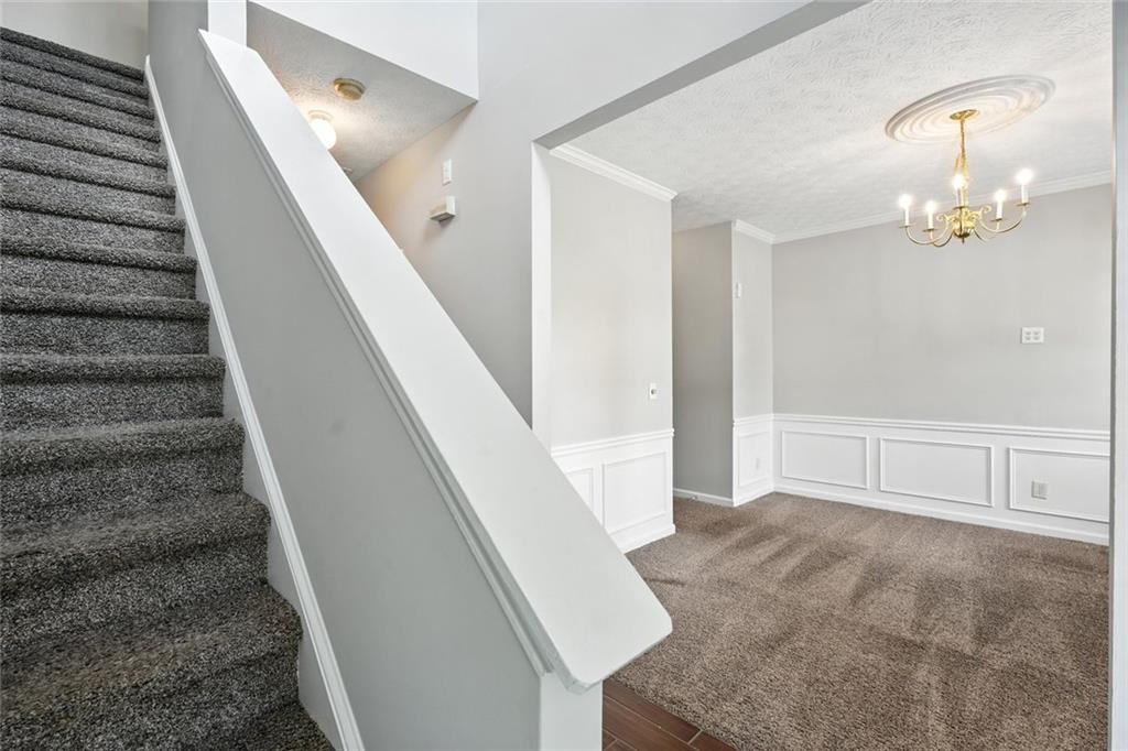 5487 Walnut Lane Lithonia, GA 30038 - Photo 7 of 43 a view of entryway and hall with a chandelier