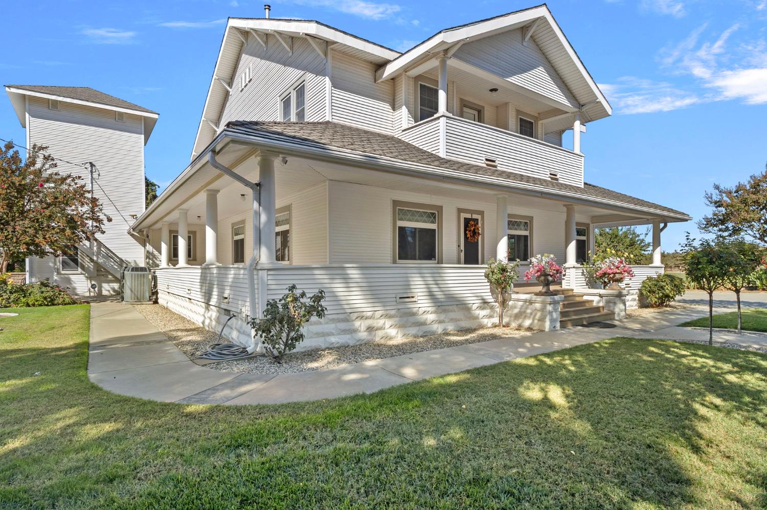 a view of a house with backyard porch and sitting area
