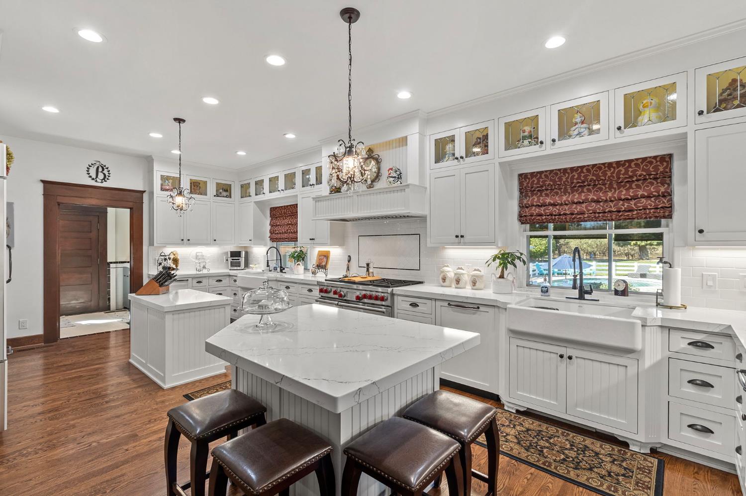 5237 Crows Landing Road Modesto, CA 95358 - Photo 22 of 87 a kitchen with a dining table chairs cabinets wooden floor and appliances
