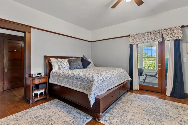 a bedroom with a bed couch and window