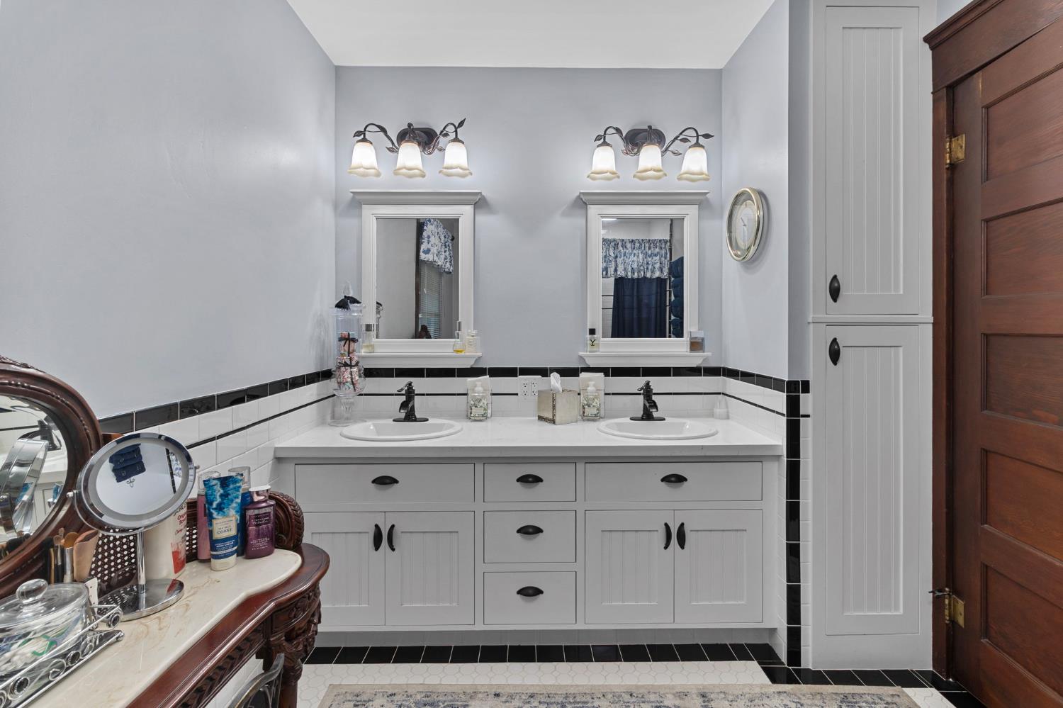 5237 Crows Landing Road Modesto, CA 95358 - Photo 31 of 87 a bathroom with double vanity and a mirror