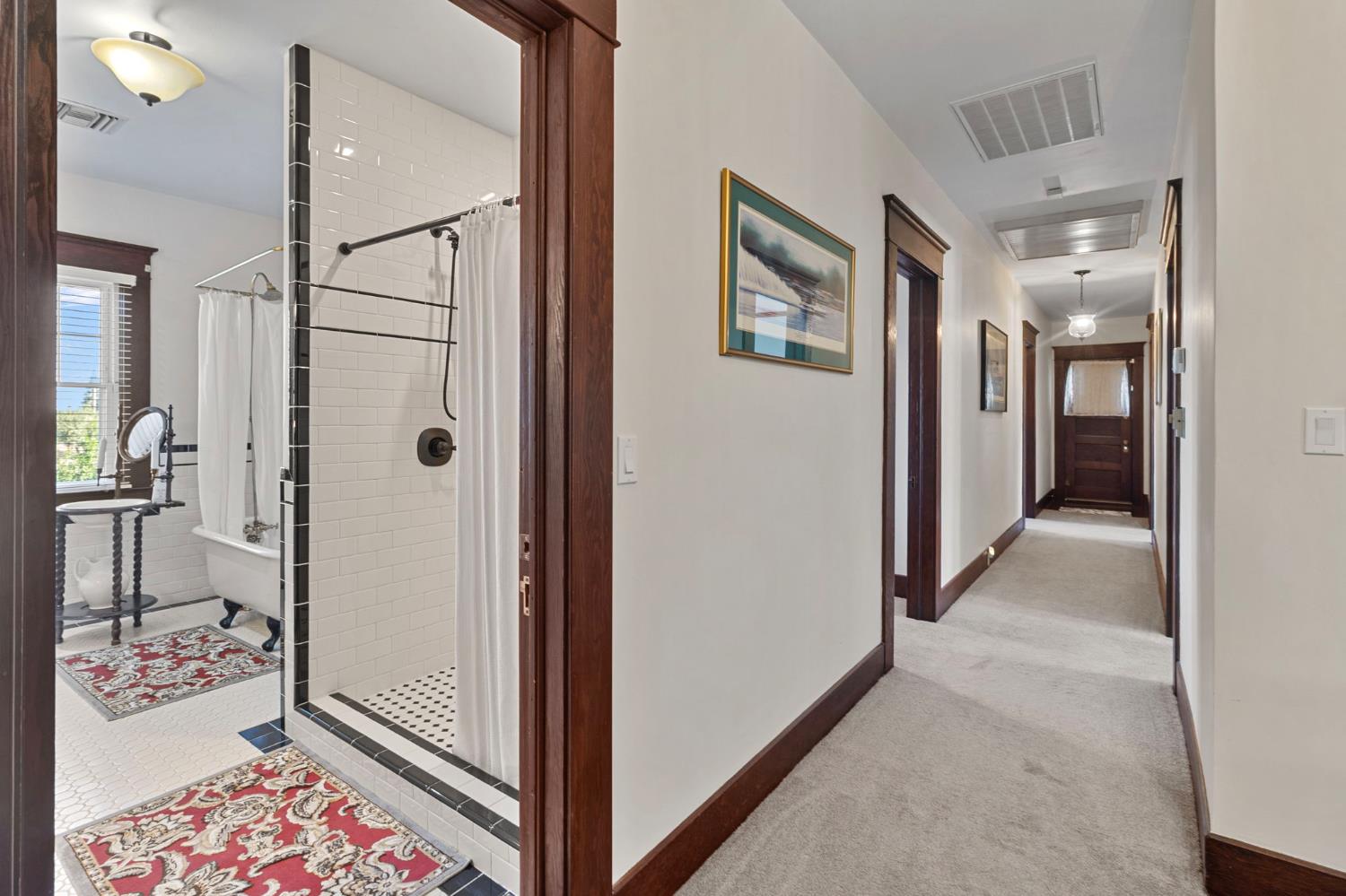 5237 Crows Landing Road Modesto, CA 95358 - Photo 33 of 87 a view of a hallway with bathroom and wooden floor