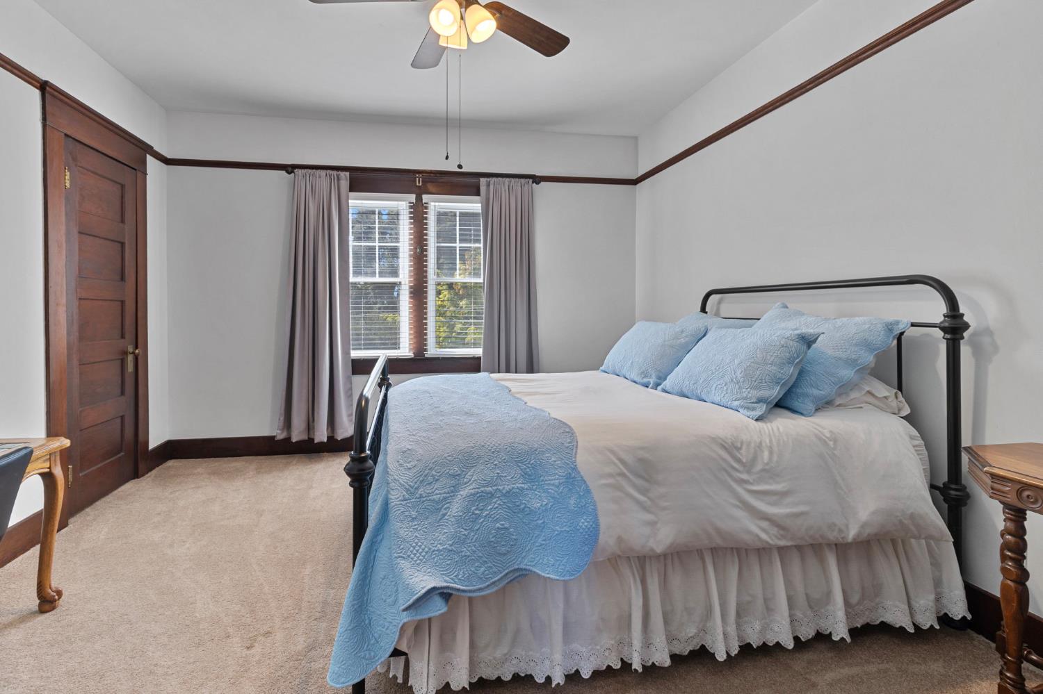 5237 Crows Landing Road Modesto, CA 95358 - Photo 37 of 87 a bedroom with a bed and a chandelier