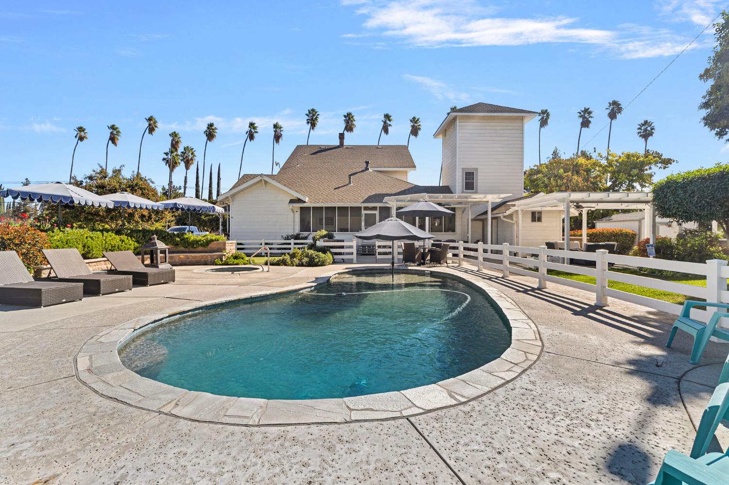 5237 Crows Landing Road Modesto, CA 95358 - Photo 50 of 87 a view of a swimming pool with outdoor seating