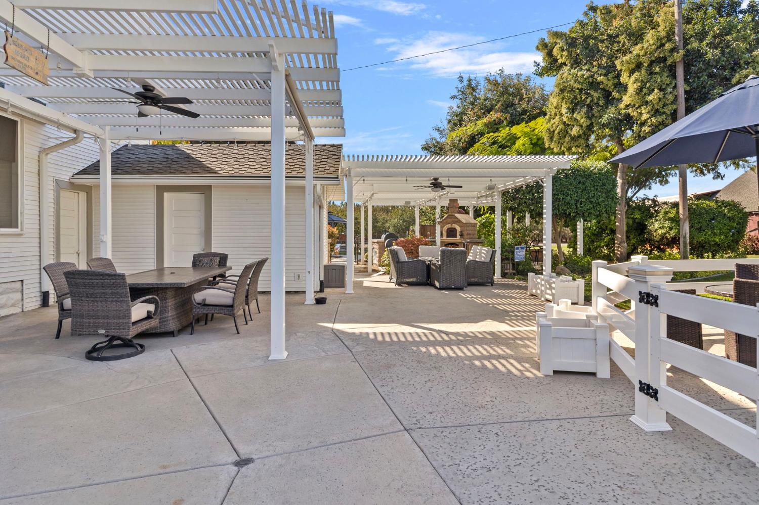 5237 Crows Landing Road Modesto, CA 95358 - Photo 52 of 87 a building outdoor space with patio furniture and potted plants