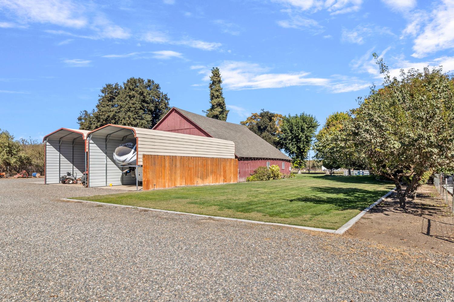 5237 Crows Landing Road Modesto, CA 95358 - Photo 64 of 87 a front view of a house with a yard and garage