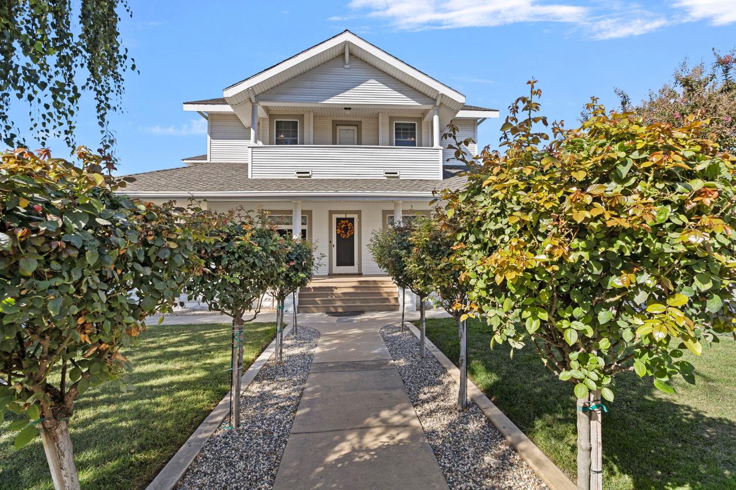 5237 Crows Landing Road Modesto, CA 95358 - Photo 7 of 87 a front view of a house with a yard