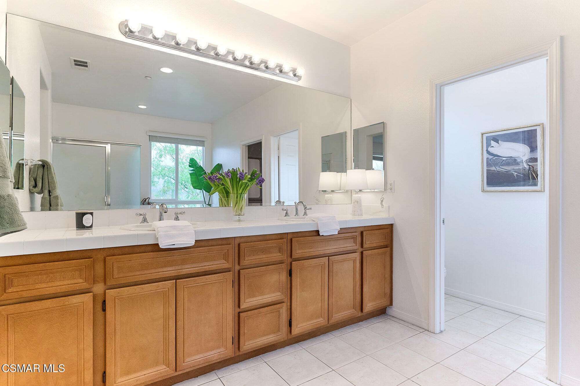 1476 Hidden Ranch Drive Simi Valley, CA 93063 - Photo 54 of 72 a bathroom with a double vanity sink mirror and