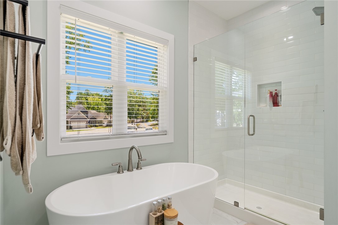 502 Canebrake Drive Anderson, SC 29621 - Photo 22 of 39 This serene bathroom offers a soaking tub and a spacious walk-in shower for ultimate relaxation.