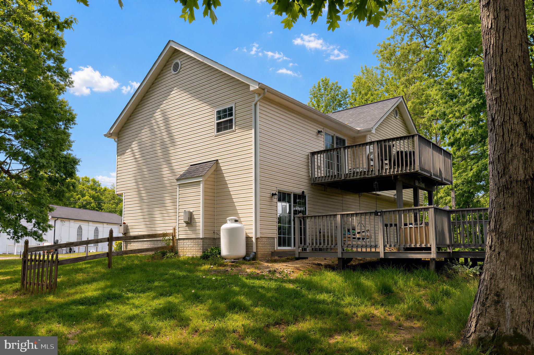 23801 McIntosh Road Hollywood, MD 20636 - Photo 31 of 35 a view of a house with a back yard