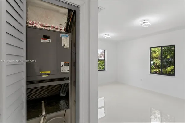 a view of an empty room with a window