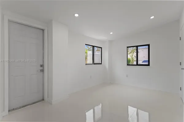 a view of an empty room with a window