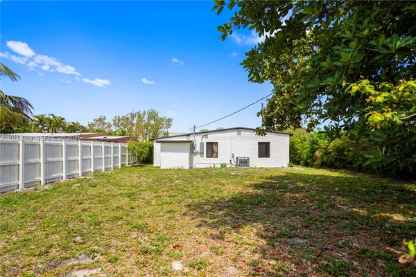 a view of backyard and tree
