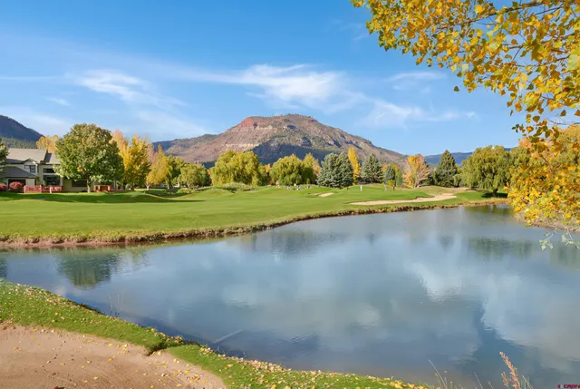 a view of a lake with a building in the background
