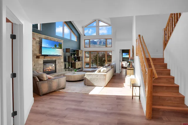 a living room with furniture and a fireplace