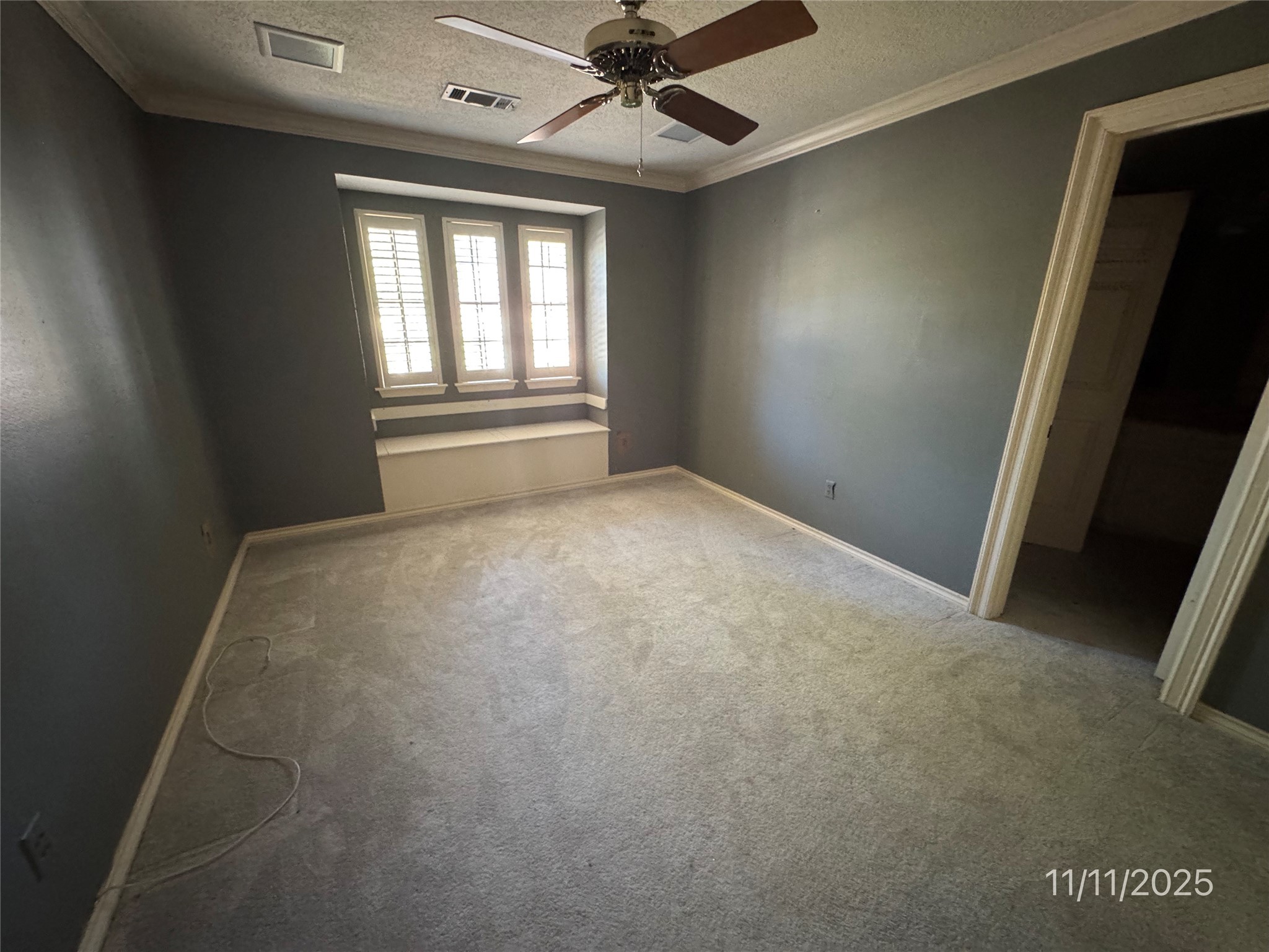 5223 Charnwick Court Houston, TX 77069 - Photo 13 of 28 an empty room with windows and fan