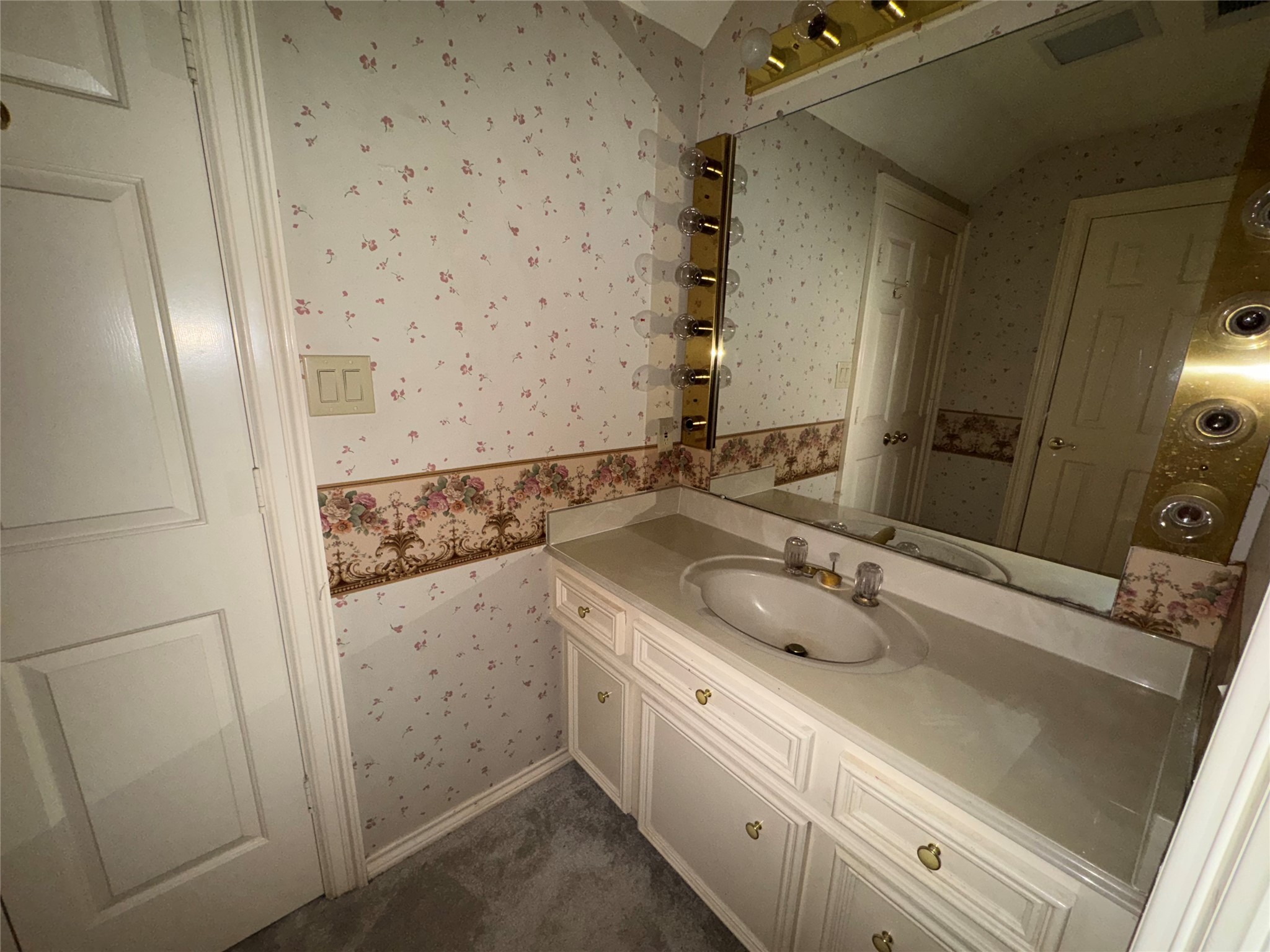 5223 Charnwick Court Houston, TX 77069 - Photo 22 of 28 a bathroom with a sink and a mirror