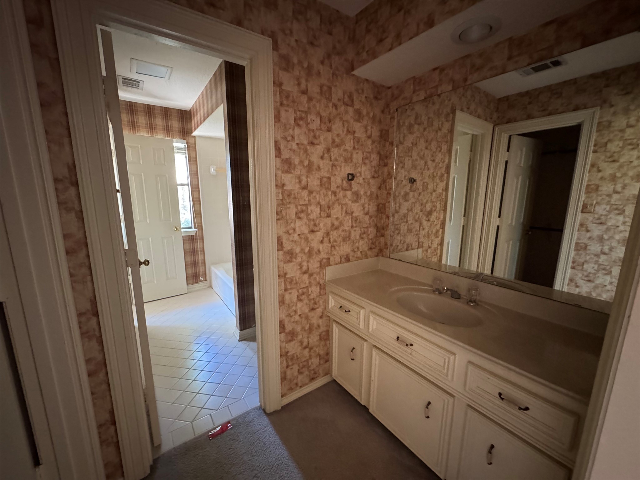 5223 Charnwick Court Houston, TX 77069 - Photo 23 of 28 a bathroom with a granite countertop sink and a mirror