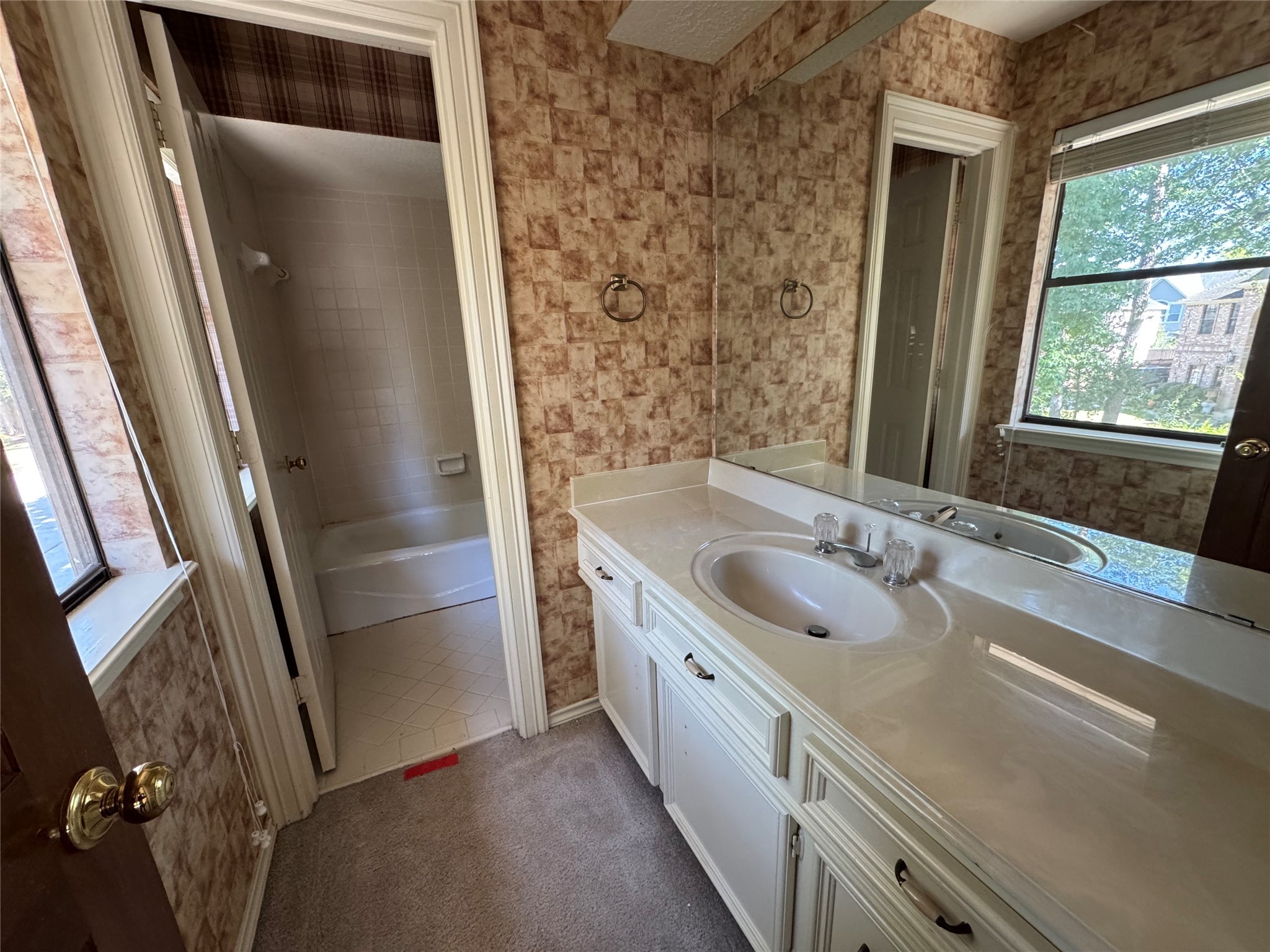 5223 Charnwick Court Houston, TX 77069 - Photo 25 of 28 a bathroom with a granite countertop sink toilet and shower