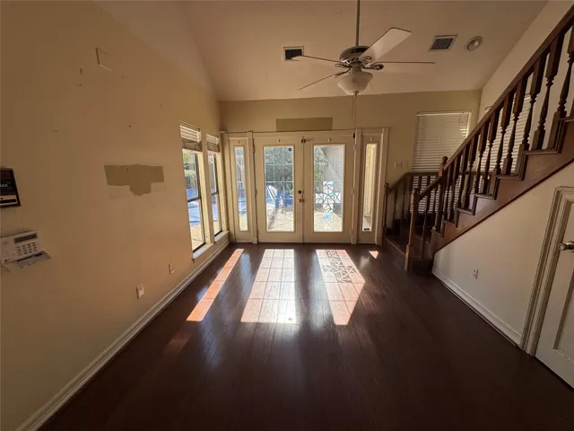 a view of a refrigerator in kitchen and wooden floor