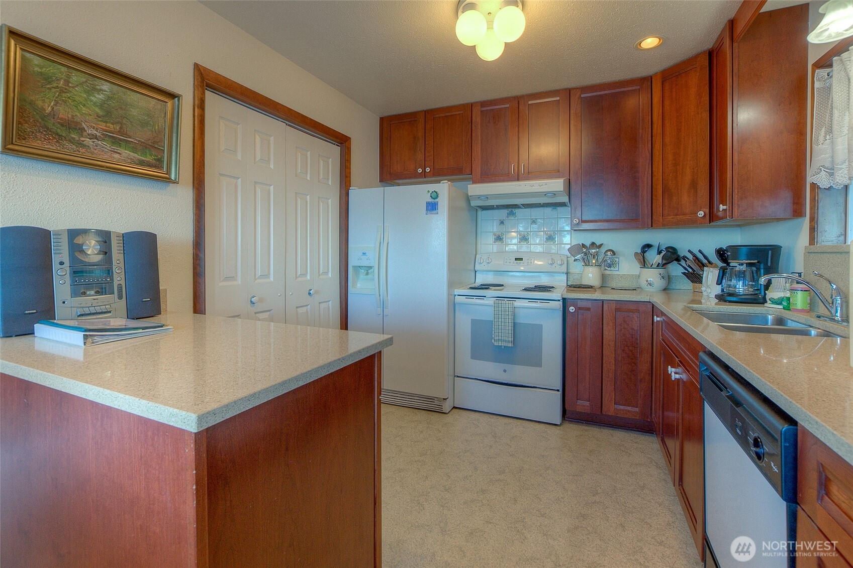 673 Raccoon Point Road Orcas Island, WA 98245 - Photo 14 of 40 a kitchen with stainless steel appliances granite countertop a sink stove and refrigerator