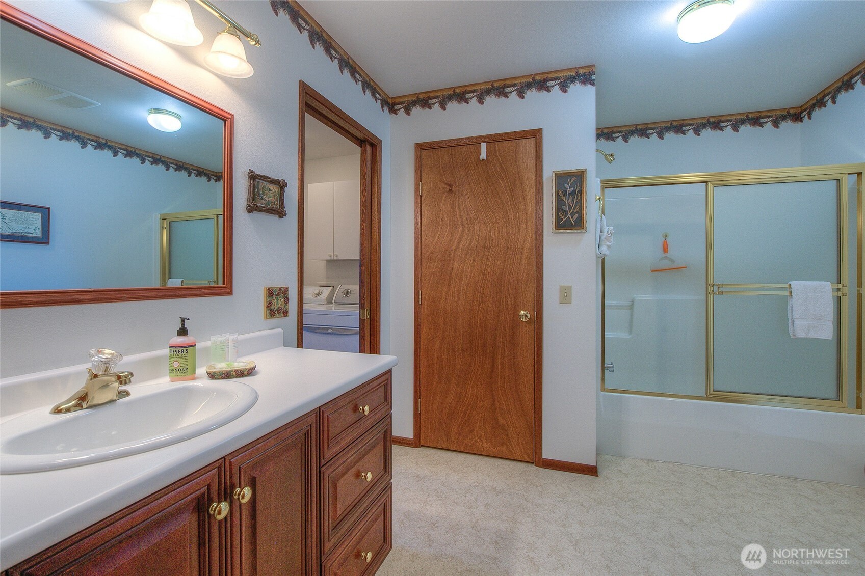 673 Raccoon Point Road Orcas Island, WA 98245 - Photo 28 of 40 a bathroom with a sink and a mirror