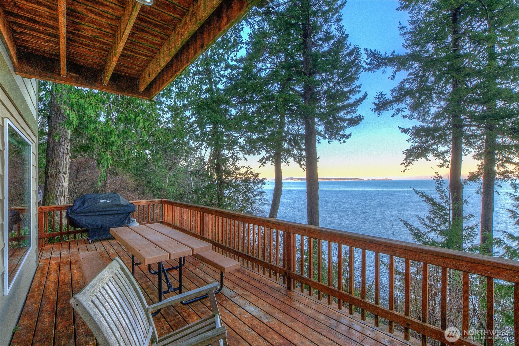 673 Raccoon Point Road Orcas Island, WA 98245 - Photo 35 of 40 a view of balcony with wooden floor and outdoor seating