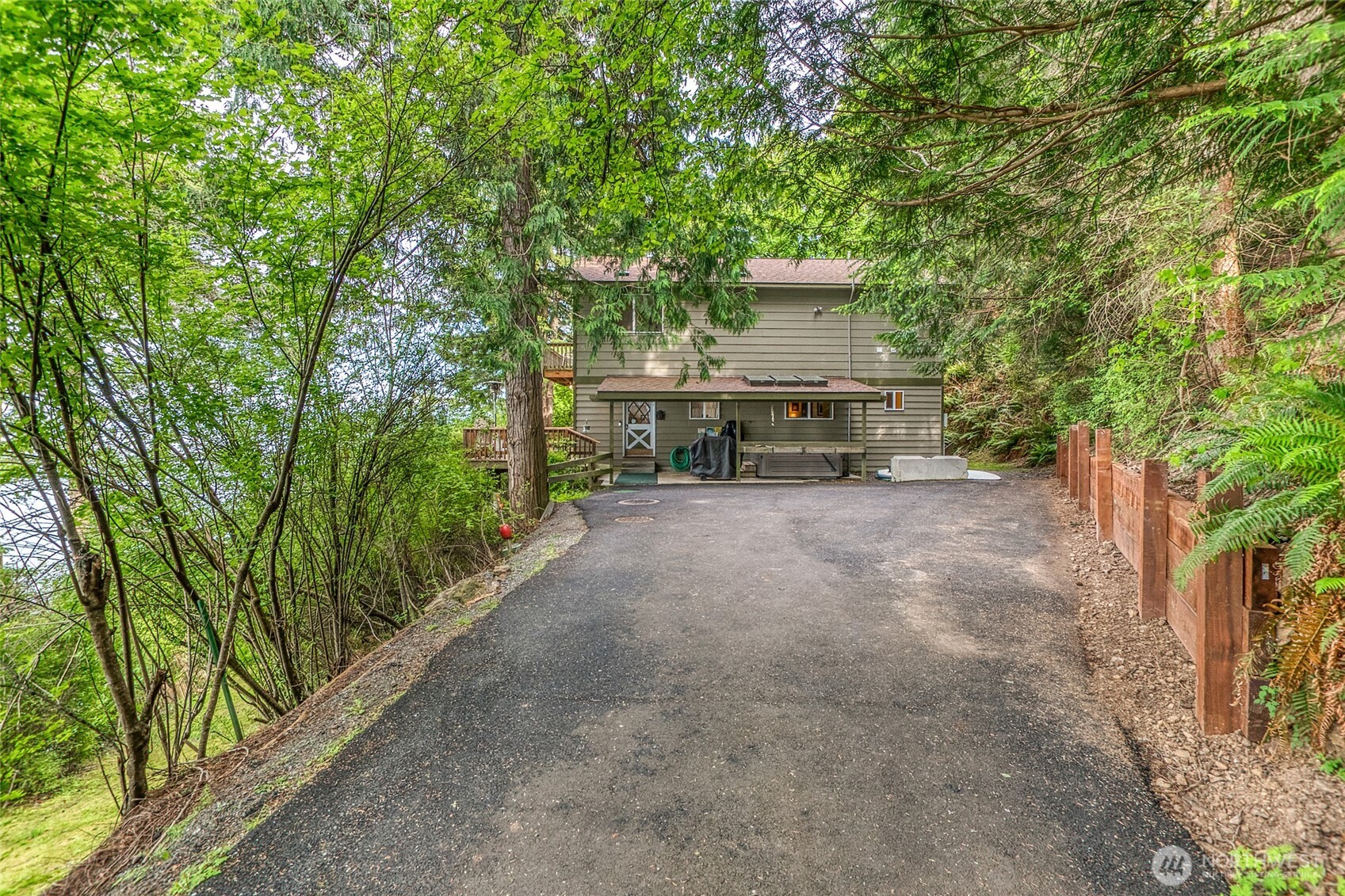 673 Raccoon Point Road Orcas Island, WA 98245 - Photo 37 of 40 a view of a chairs and table in the backyard