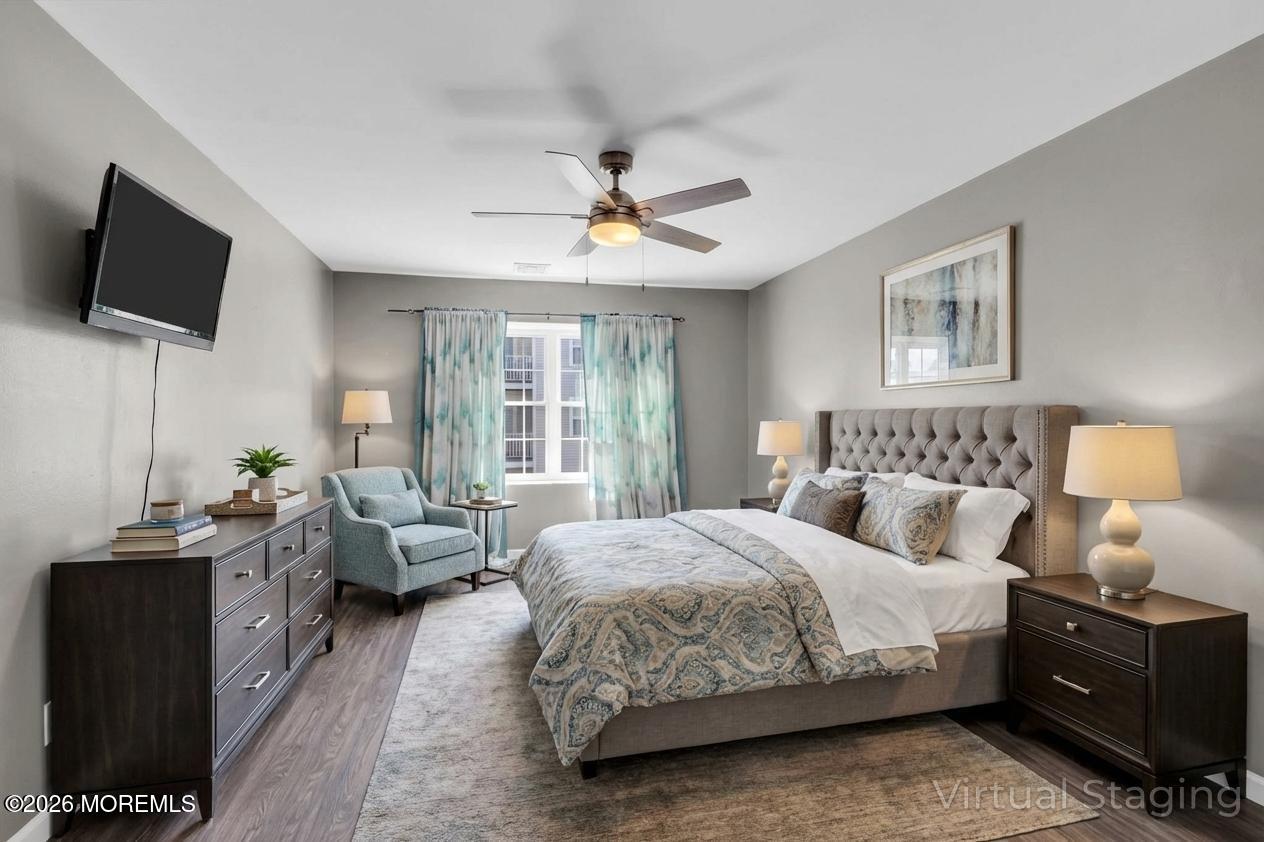 231 Atlantic Street, Unit 55 Keyport, NJ 07735 - Photo 13 of 31 a bedroom with a bed and tv