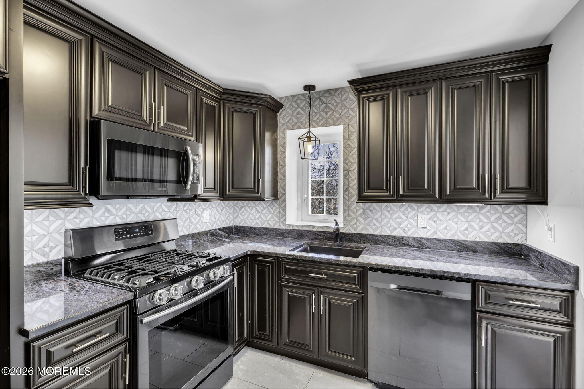 231 Atlantic Street, Unit 55 Keyport, NJ 07735 - Photo 2 of 31 a kitchen with granite countertop stainless steel appliances and cabinets