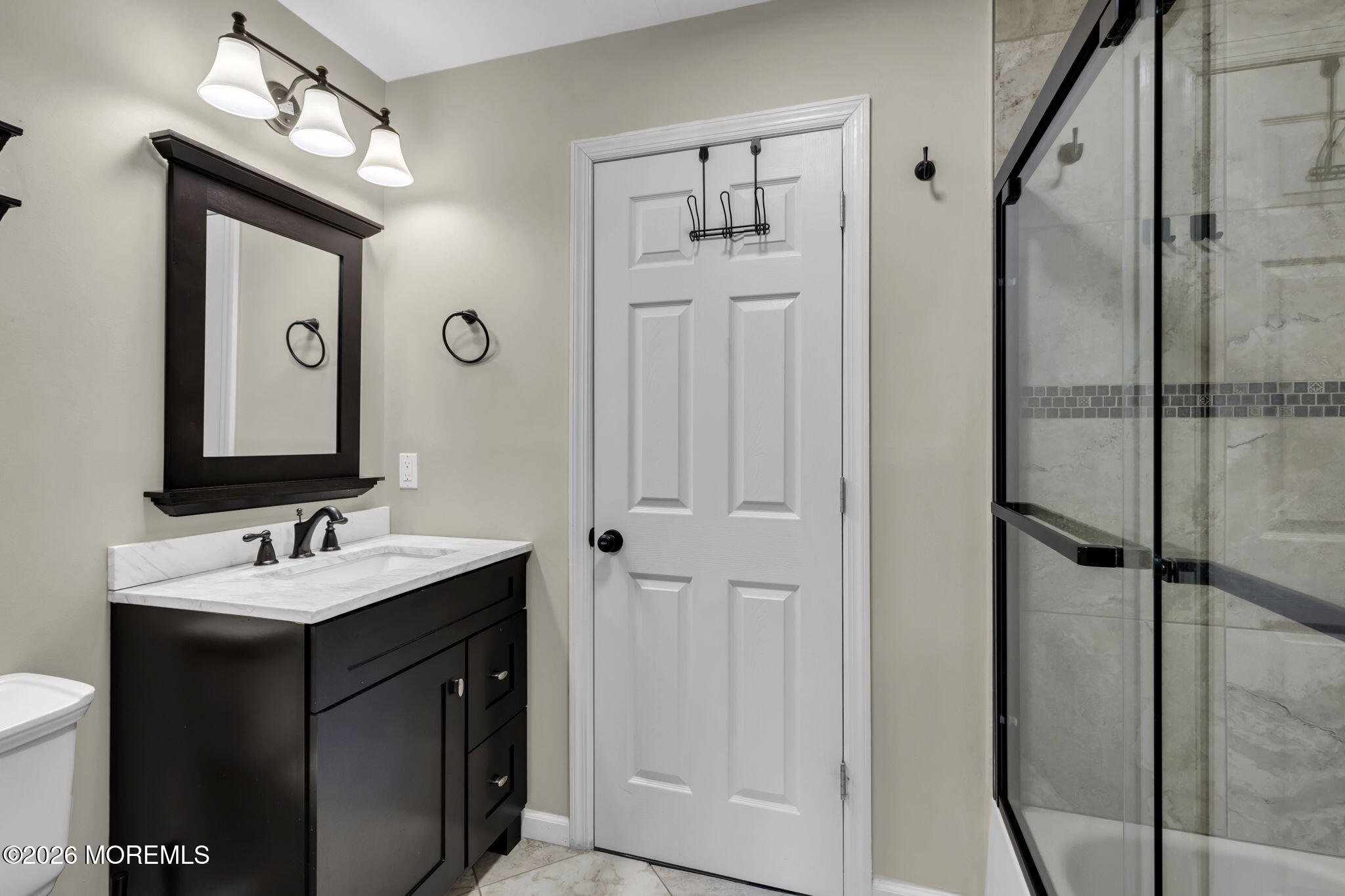 231 Atlantic Street, Unit 55 Keyport, NJ 07735 - Photo 22 of 31 a bathroom with a double vanity sink mirror and shower