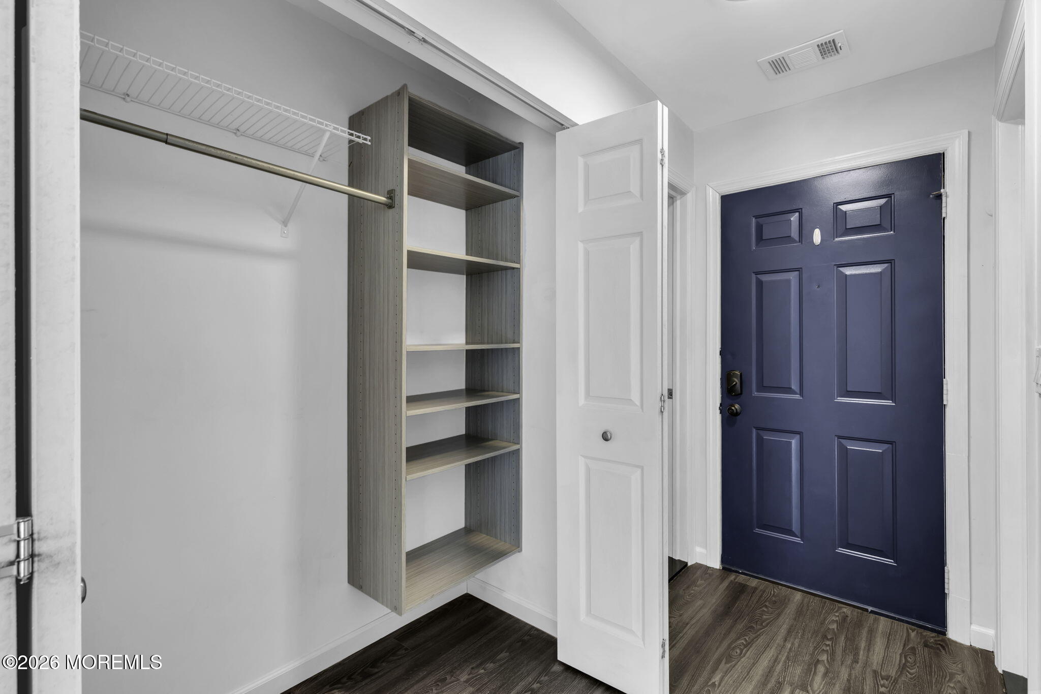 231 Atlantic Street, Unit 55 Keyport, NJ 07735 - Photo 25 of 31 a view of walk in closet with empty racks