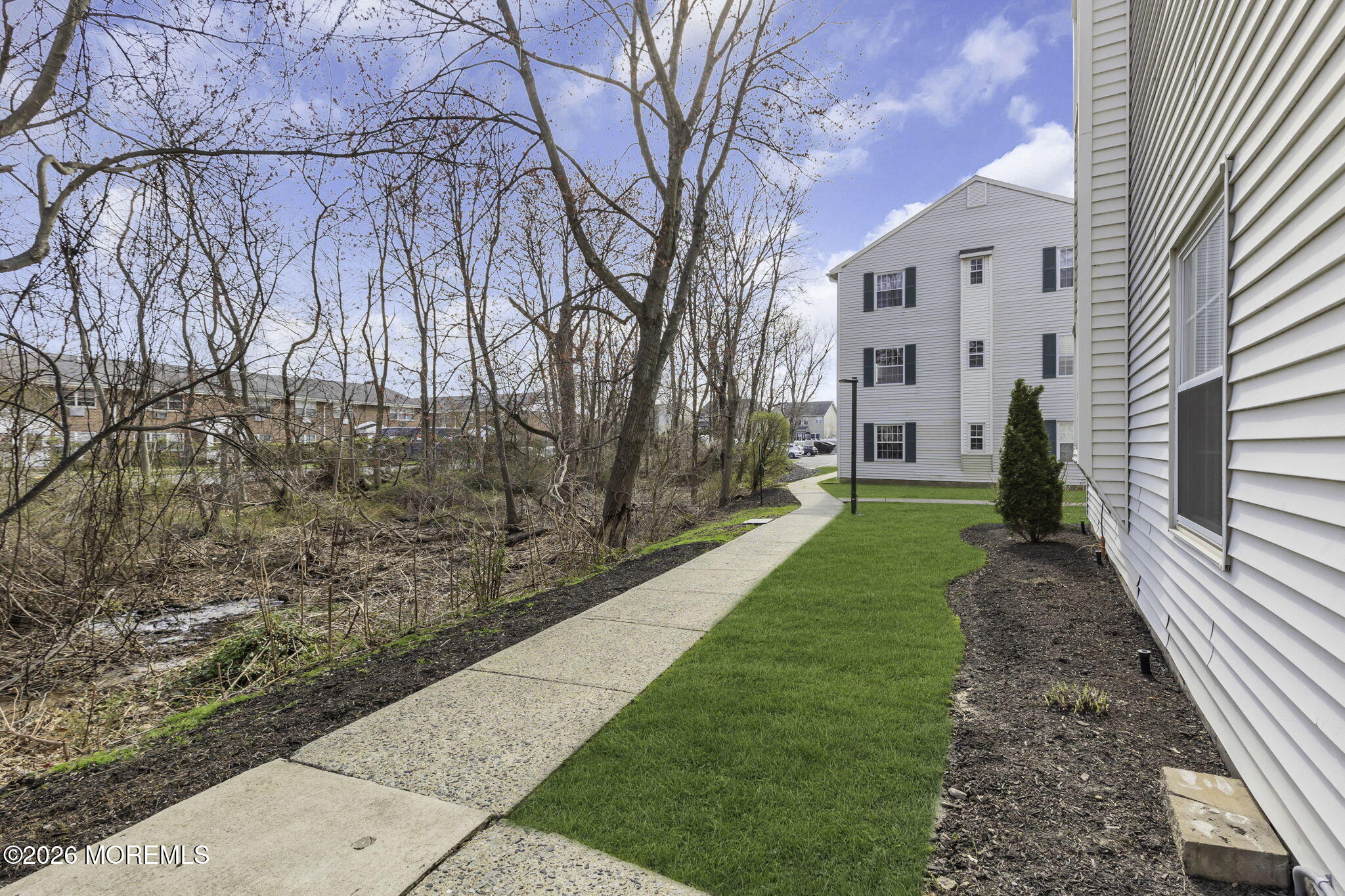 231 Atlantic Street, Unit 55 Keyport, NJ 07735 - Photo 30 of 31 a view of a pathway with a yard