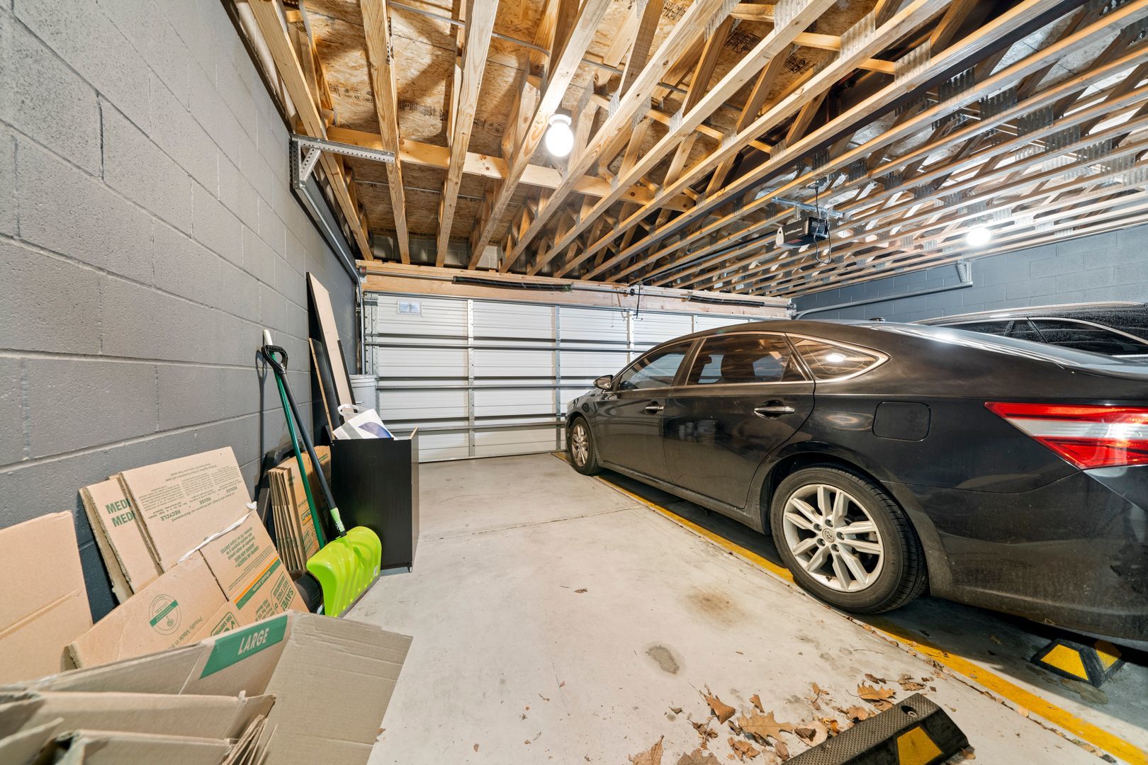 2304 West Jackson Boulevard, Unit 1E Chicago, IL 60612 - Photo 17 of 20 a view of garage with a car parked in it