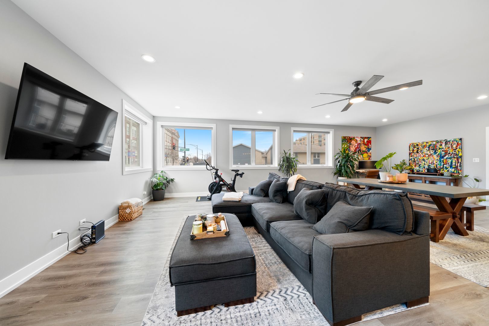 2304 West Jackson Boulevard, Unit 1E Chicago, IL 60612 - Photo 4 of 20 a living room with furniture kitchen view and a flat screen tv