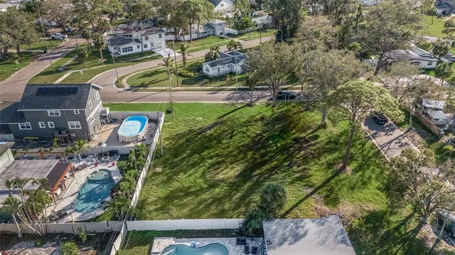 a aerial view of a residential houses with outdoor space