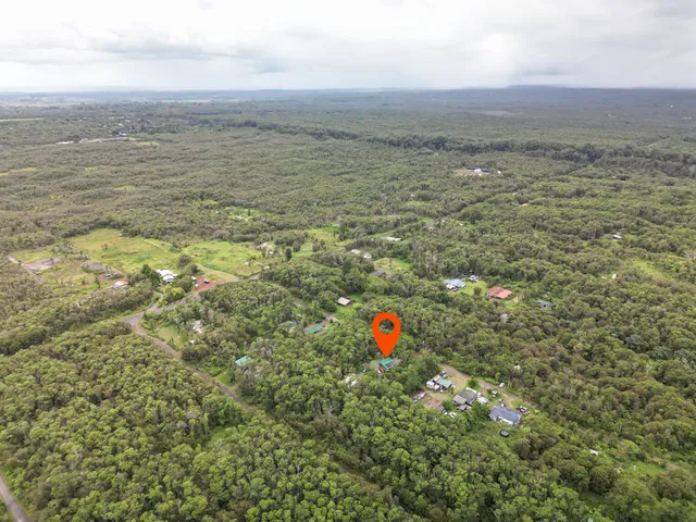 a view of a car parked in front of a house